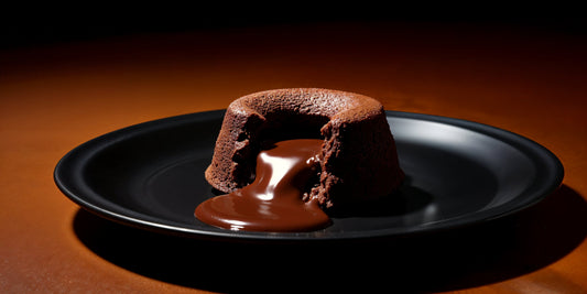 Chocolate pudding with rich, glossy chocolate oozing from the centre, decadent and indulgent dessert.