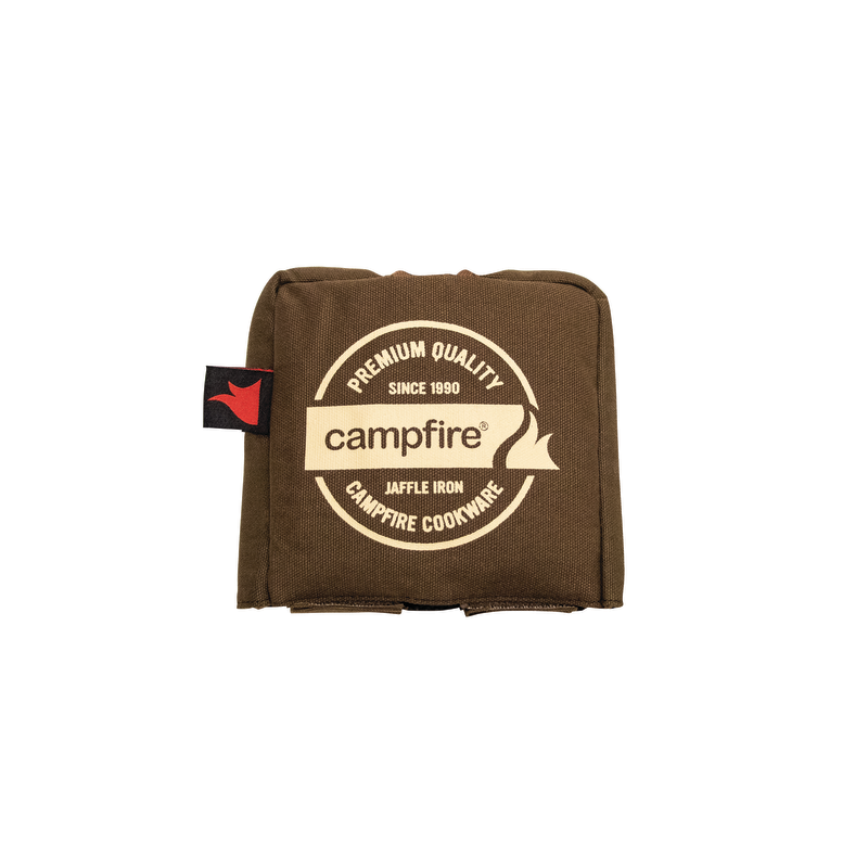 The Campfire Canvas Bag Jumbo Jaffle Single is a brown, durable canvas cover designed to fit your jumbo single jaffle iron. It features padded protection and is adorned with a circular "Campfire" logo alongside the text "Premium Quality Since 1990" against a white background, ensuring your jaffle iron stays safe and secure.