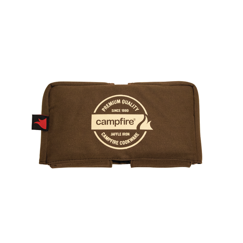 The Campfire brand Canvas Bag Jaffle Iron Double Jumbo is a brown padded cover featuring a cream circular logo with the words "Premium Quality, Campfire, Jaffle Iron, Campfire Cookware," and a red tag on the left side. Designed to fit your Jumbo Double Jaffle Iron, this durable canvas bag offers padded walls for extra protection. The background is white.
