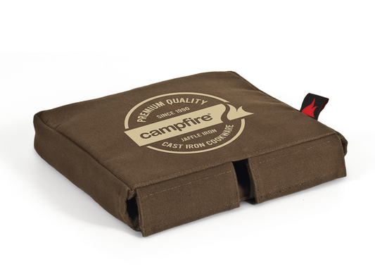 A brown, square-shaped Canvas Bag Jaffle Quad from Campfire, with padded walls, the “campfire” logo and “Premium Quality Cast Iron Cookware” printed on top, plus a small red tag on the side—perfect for storing your Jumbo Quad Jaffle Iron.