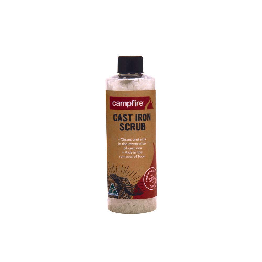 A bottle of Campfire Cast Iron Scrub with a black cap and brown label, formulated to clean and restore cast iron cookware using Australian rock salt.