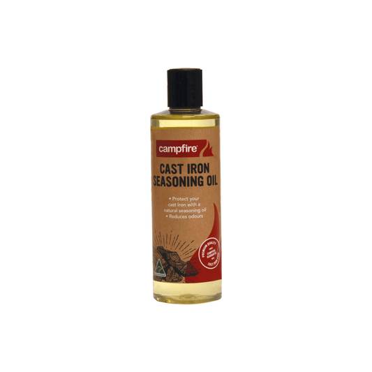 A bottle of Campfire Cast Iron Seasoning Oil, featuring a black cap and a brown label, crafted from high-quality coconut oil to protect your cast iron cookware and reduce odor.