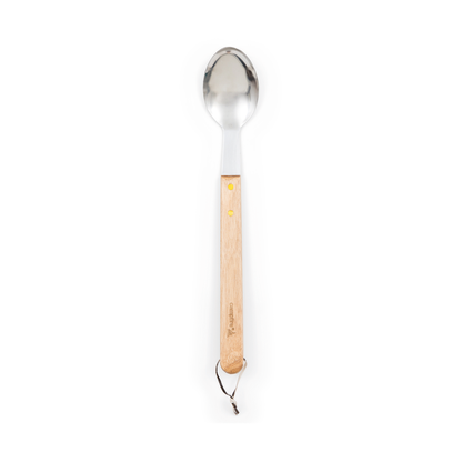 A Campfire 22pc BBQ Set stainless steel spoon with a light wooden handle and two brass rivets, featuring a leather loop at the end—ideal for outdoor cooking—photographed on a white background.