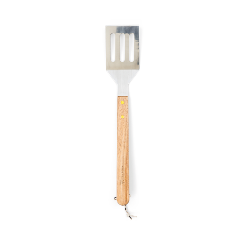 A Campfire 22pc BBQ Set spatula featuring a slotted stainless steel head and a long wooden handle, perfect for outdoor cooking, is photographed on a white background.