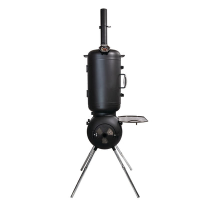 The Ozpig Series 2 Smoker Combo by Ozpig features a black vertical smoker grill with a cylindrical smoking chamber above a round firebox, supported by four angled metal legs. It includes a small side shelf and a thermometer mounted on the top chamber. Inspired by the Ozpig Oven Smoker design, this portable smoker offers versatile wood-fired oven cooking, making it ideal for outdoor gatherings.