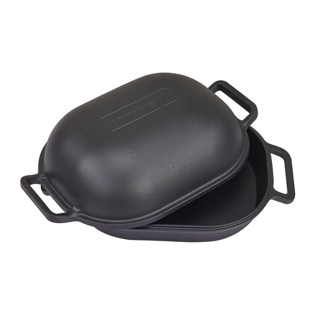 A black Campfire Combo Camp Oven with a matching domed lid, each end fitted with sturdy handles. The pre-seasoned lid is partially raised to reveal the oven’s spacious interior—ideal for campfire cooking.