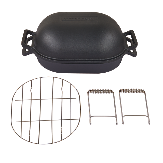 A Campfire Combo Camp Oven in black, pre-seasoned cast iron with a lid, displayed alongside a round metal rack and two metal lifting tools on a white background—ideal for campfire cooking.