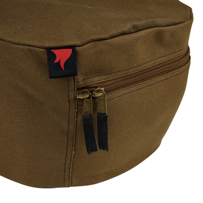 Close-up of the Campfire Combo Camp Oven Canvas Bag, featuring a brown canvas exterior, zippered pocket with two zipper pulls outfitted with black cords, reinforced handles, and a small black tag displaying a red flame design.