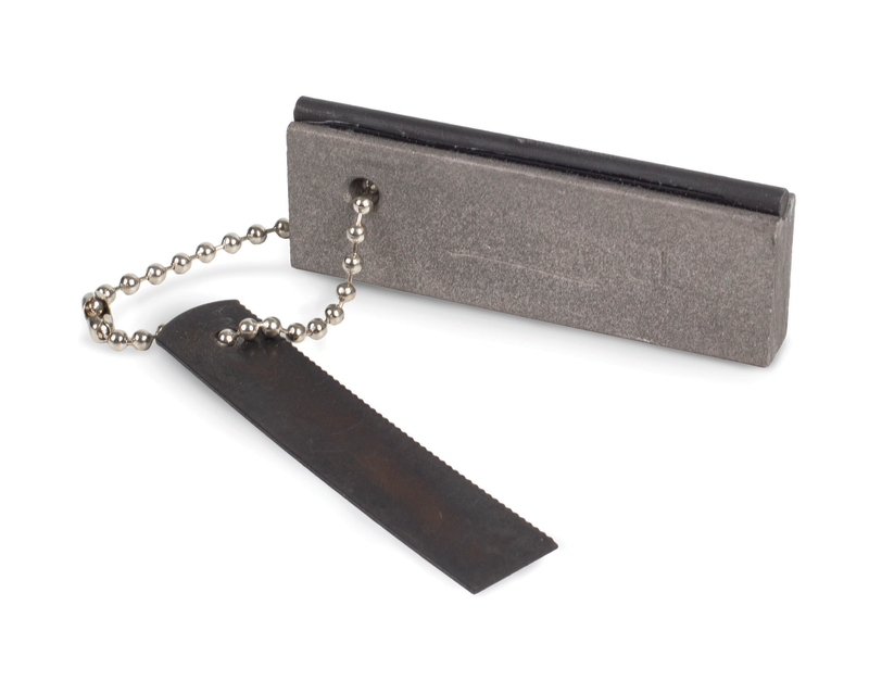 The Elemental Magnesium Fire Starter is a rectangular gray magnesium block with a black flint strip, attached to a metal striker on a small beaded chain. This durable fire starter is an essential outdoor tool for reliably starting fires while camping.