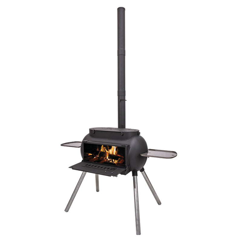 The Ozpig Big Pig by Ozpig is a black outdoor wood stove featuring four sturdy legs, an open front door displaying burning firewood, a tall chimney pipe, and two convenient side shelves—ideal for woodfired cooking or serving as a versatile home heating solution.