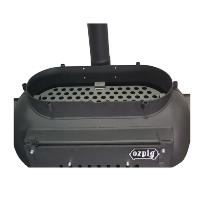 Ozpig Big Pig Charcoal Plate by Ozpig, shown from above against a white background, featuring a perforated grill plate, an internal charcoal plate, and a vertical chimney pipe—ideal for outdoor cooking enthusiasts.