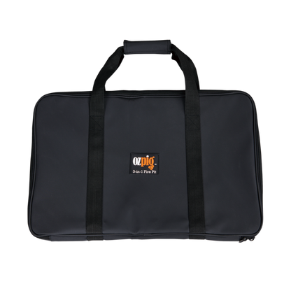 A black rectangular carrying case with handles and a padded grip, featuring the "Ozpig 3-in-1 Flat Pack Fire Pit" logo on the front—perfect for transporting your Ozpig portable fire pit to any campsite or outdoor adventure.