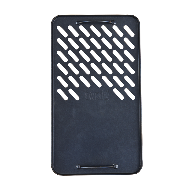 The Ozpig Fire Pit Solid/Grill Cooking Plate by Ozpig is a black, rectangular grilling accessory crafted from heavy-duty steel, designed with diagonal slits on the upper half and two small side handles—ideal for use as a grill cooking plate with your Ozpig 3 in 1 Flat Pack Fire Pit.