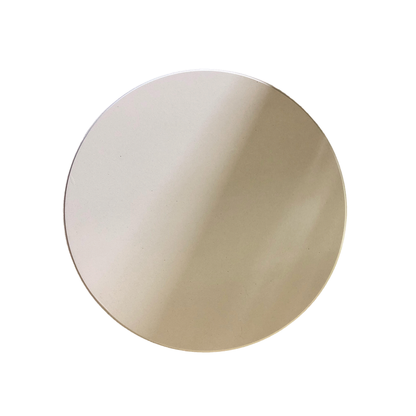 A simple, round, beige ceramic plate is shown from above against a white background—ideal for serving slices of crispy pizza crust baked on the Ozpig Oven Smoker 9" Pizza Stone by Ozpig.