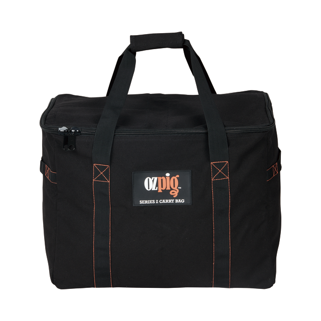 The Ozpig Series 2 Heavy Duty Storage Bag by Ozpig is made from black heavy-duty cotton canvas with orange stitching. It features two handles, a zippered top, and a front pocket displaying the logo and series label. Internal storage pockets are included to help keep your accessories organised.