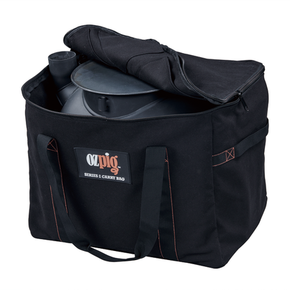 A black heavy duty cotton canvas storage bag with handles, partially open to reveal a metal Ozpig grill inside. The front label reads "Ozpig Series 2 Heavy Duty Storage Bag." Designed for convenience by Ozpig, this bag also features internal storage pockets to keep your accessories organised.