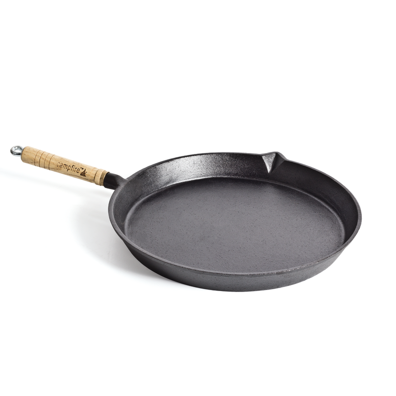 The Campfire Round Frying Pan - Solid Handle 30cm is a versatile pre-seasoned black cast iron skillet featuring a solid handle and a small spout on the rim, displayed against a clean white background.