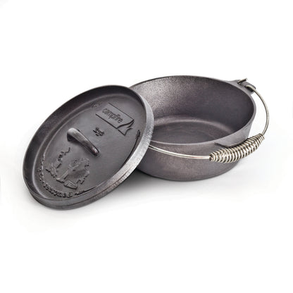 A black, pre-seasoned 2 quart Camp Oven by Campfire with a handle and a partially open lid. The lid features embossed outdoor scenery and the "Campfire" brand name, making it ideal for outdoor cooking adventures.