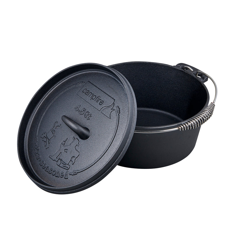 The Campfire 4.5 Quart Camp Oven, in black pre-seasoned cast iron, features a sturdy metal handle and is displayed on a white background. Its lid—embossed with a campfire design and the brand name—leans against the pot, making it ideal for outdoor cooking.