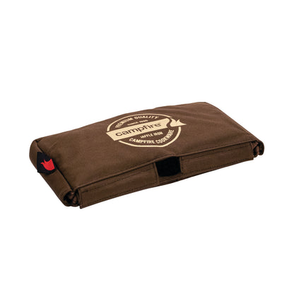 A brown, rectangular, heavy-duty canvas bag from Campfire, featuring a beige logo with “Campfire” and “High Quality, Spill Proof, Campfire Cookware” printed on top. The Canvas Bag Jaffle Iron Double Jumbo offers padded protection—perfect for carrying your Jumbo Double Jaffle Iron or other camp cookware.