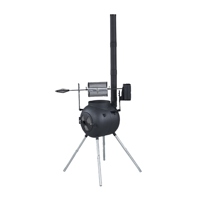 A black Ozpig outdoor wood stove with a rounded body, tall chimney, three metal legs, and an attached Ozpig Rotisserie Basket Small accessory, set against a white background.