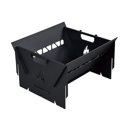 The Ozpig 3-in-1 Flat Pack Fire Pit is a black, rectangular metal unit with cut-out flame designs and hexagonal ventilation holes on the sides, shown assembled and viewed from an angle.