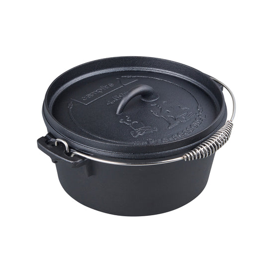 The Campfire 4.5 Quart Camp Oven is a pre-seasoned black cast iron oven with a fitted lid featuring embossed designs, a side handle, and a metal wire bail handle with coiled grip—ideal for outdoor cooking.