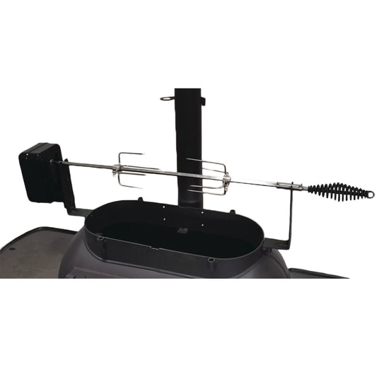 The Ozpig Big Pig Rotisserie Kit by Ozpig is shown attached to a barbecue grill, with a rotating spit rod, meat forks, and an electric motor, positioned on an open grill base against a plain white background.