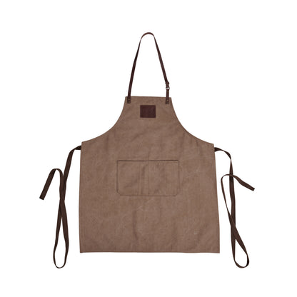 The Ozpig Apron by Ozpig, crafted from durable brown canvas, features an adjustable neck strap, a large front pocket, and two long side ties accented with subtle leather details. It is shown laid flat on a white background.