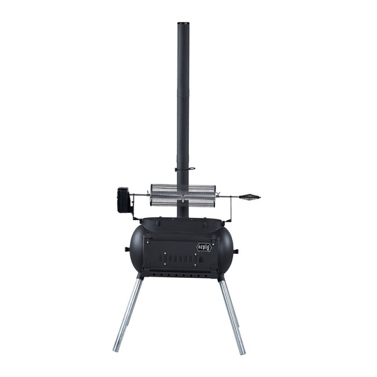 A black, portable outdoor wood stove with a tall chimney, cylindrical body, angled metal legs, and a vented door features a rotisserie attachment on top—ideal for wood-fired cooking and fully compatible with various rotisserie accessories such as the Ozpig Rotisserie Basket Large by Ozpig.