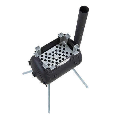 The Ozpig Traveller Charcoal Basket by Ozpig is a compact black metal camping stove, perfect for campsite cooking, featuring a perforated tray, a cylindrical body, three sturdy metal legs, and an upright chimney.