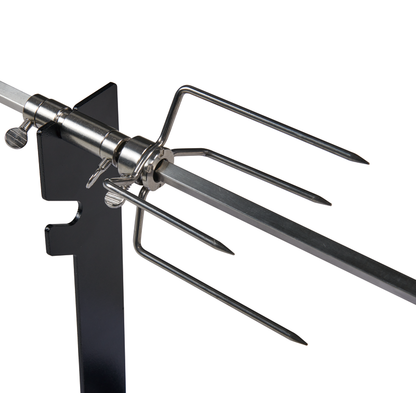Close-up of a metal rotisserie spit fork featuring four sharp prongs, attached to a square rod and mounted on a black stand—specifically designed for grilling or roasting meat with the Ozpig Traveller Rotisserie Kit by Ozpig, making it perfect for preparing charcoal chicken during your next portable rotisserie adventure.